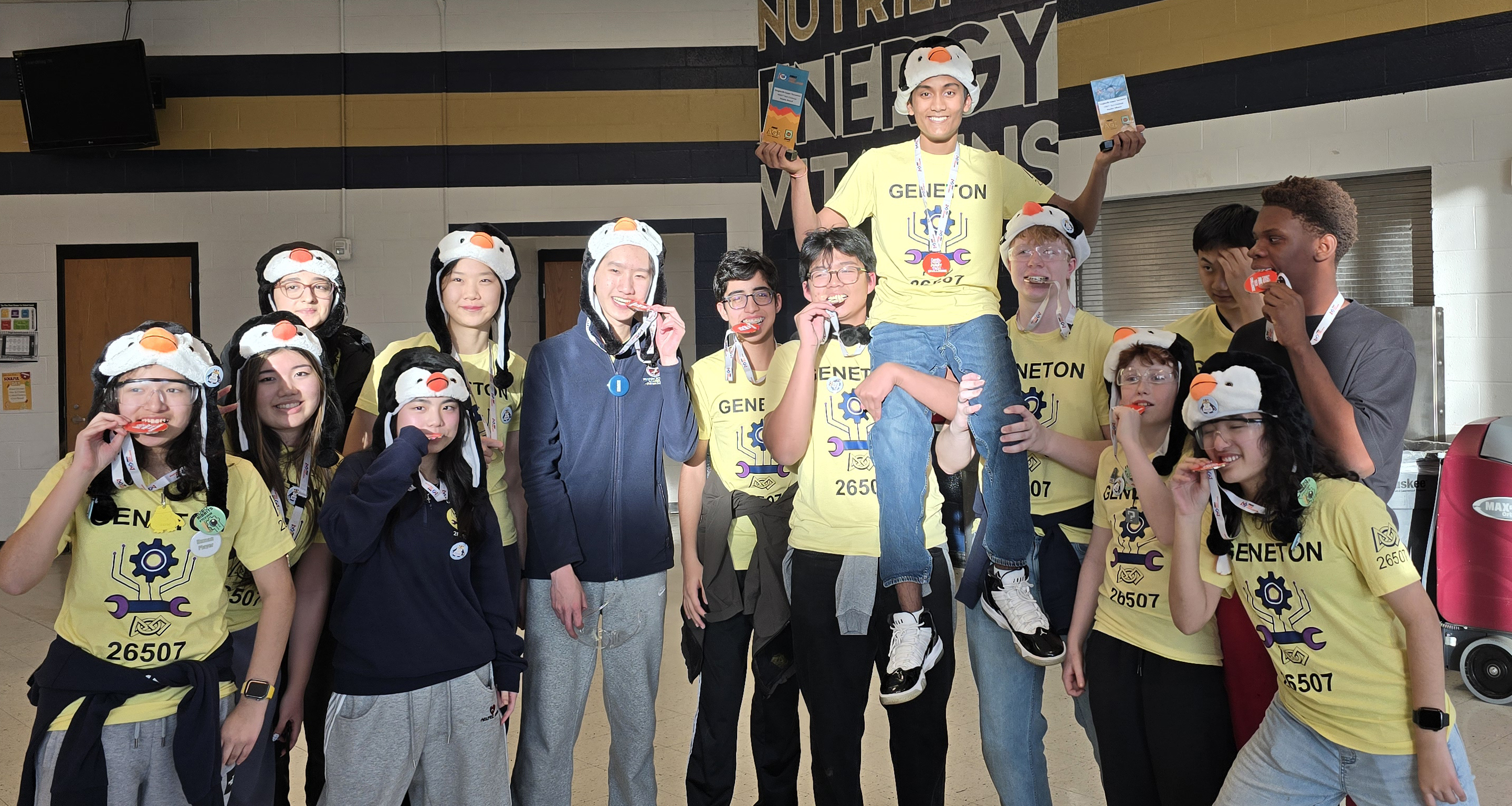 Team Geneton celebrating with medals and trophies at regionals